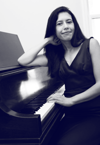 Photo of Domenique at the piano
